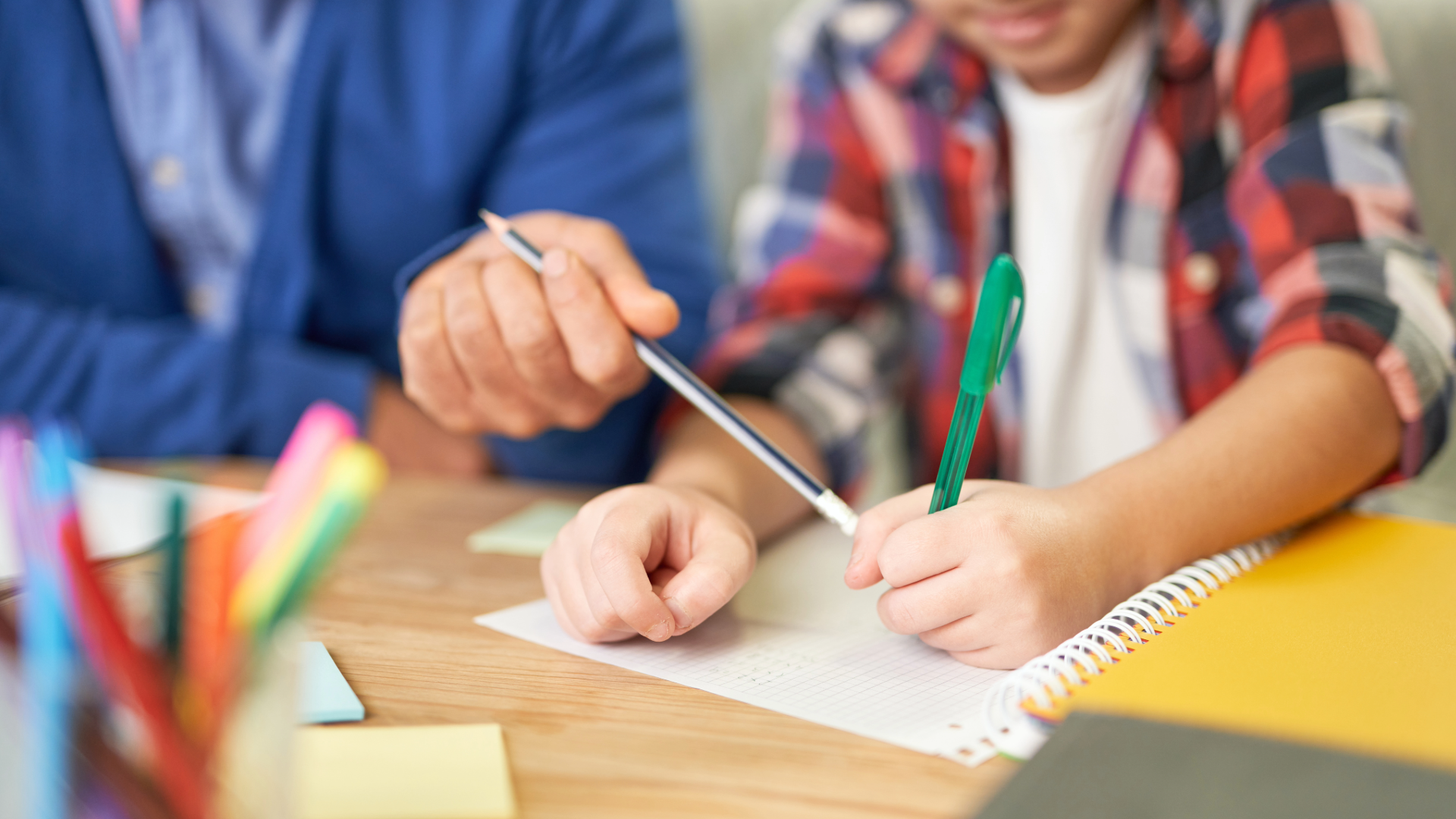 Children working together on homework at a table