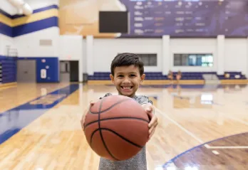 boy holding basketball