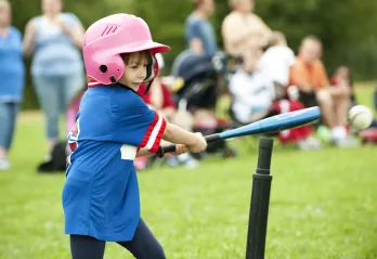 girl playing tball