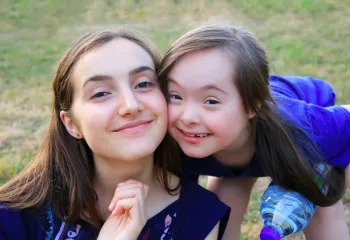 camper with counselor