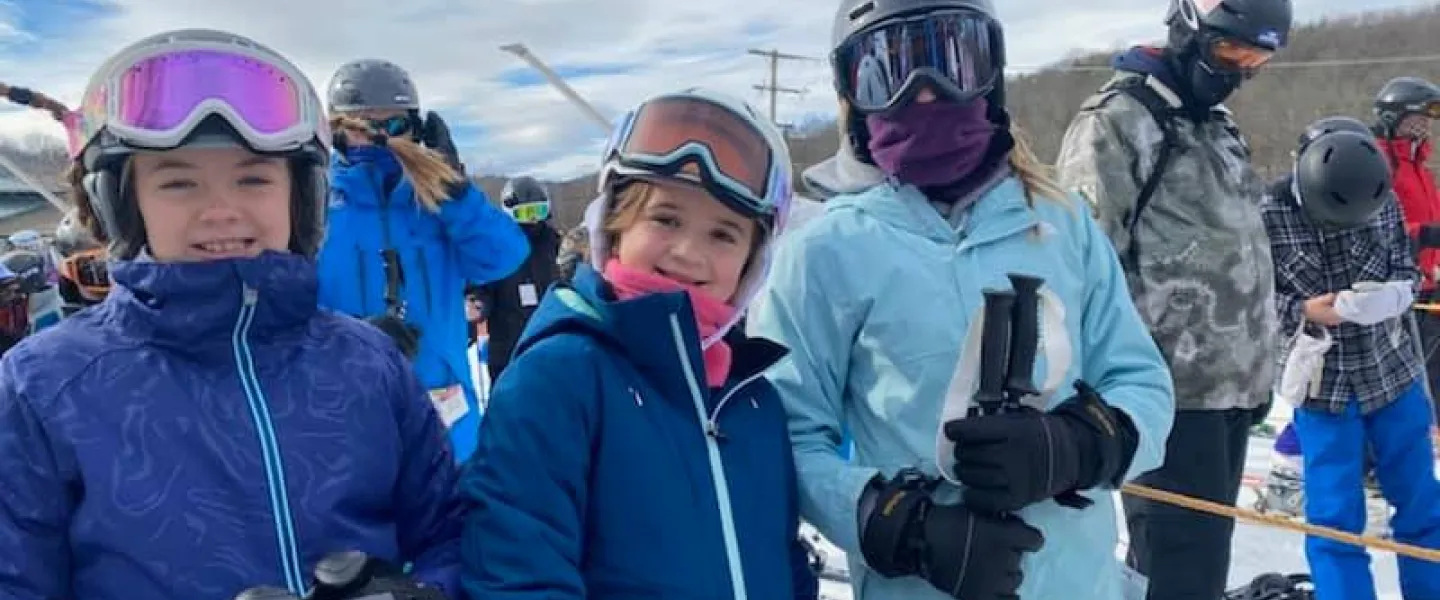 girl adventure guides at ski trip