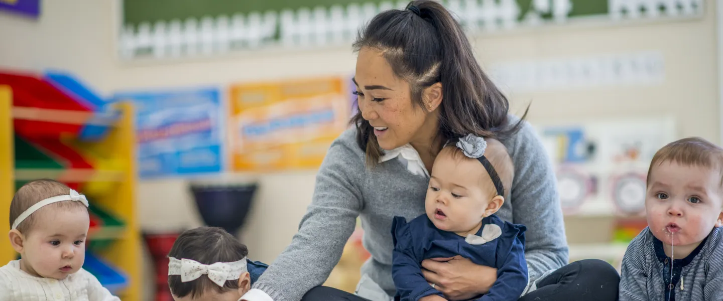 toddlers in classroom with teacher