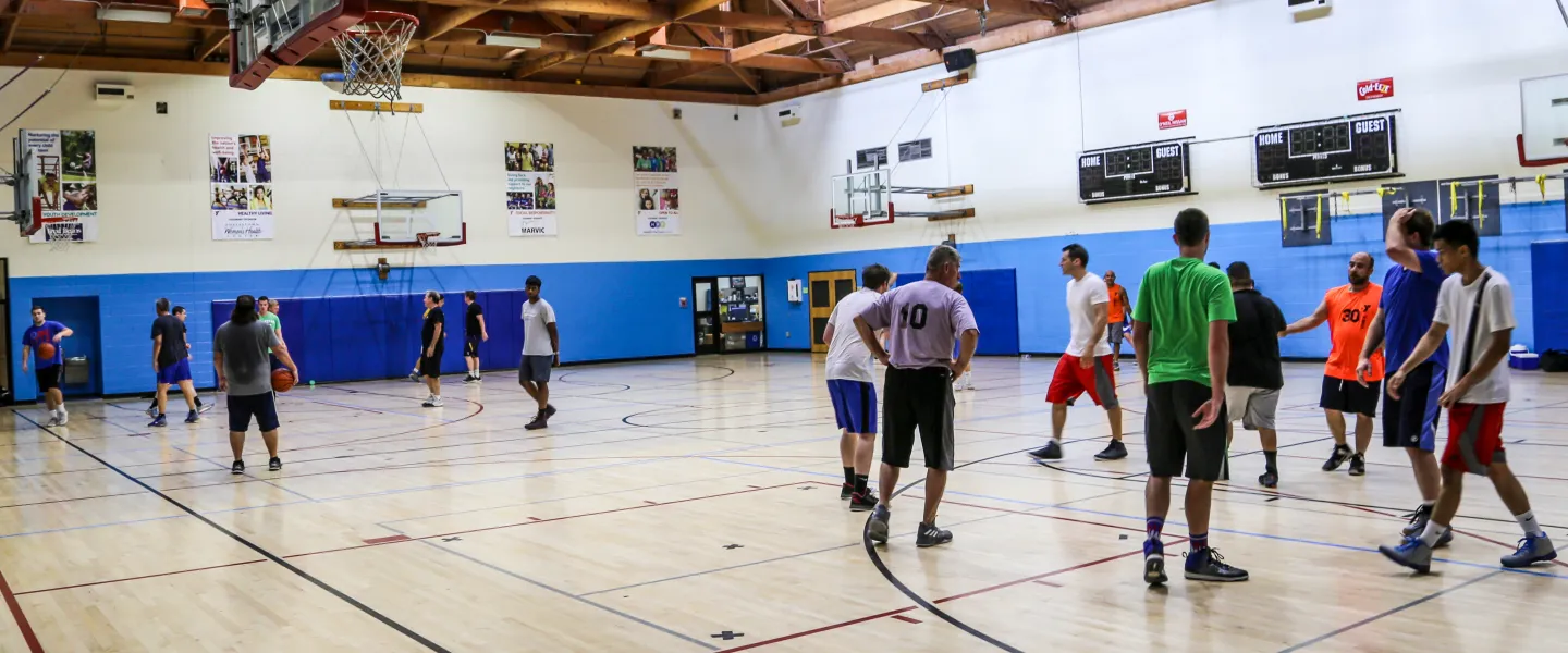 men playing basketball in gym