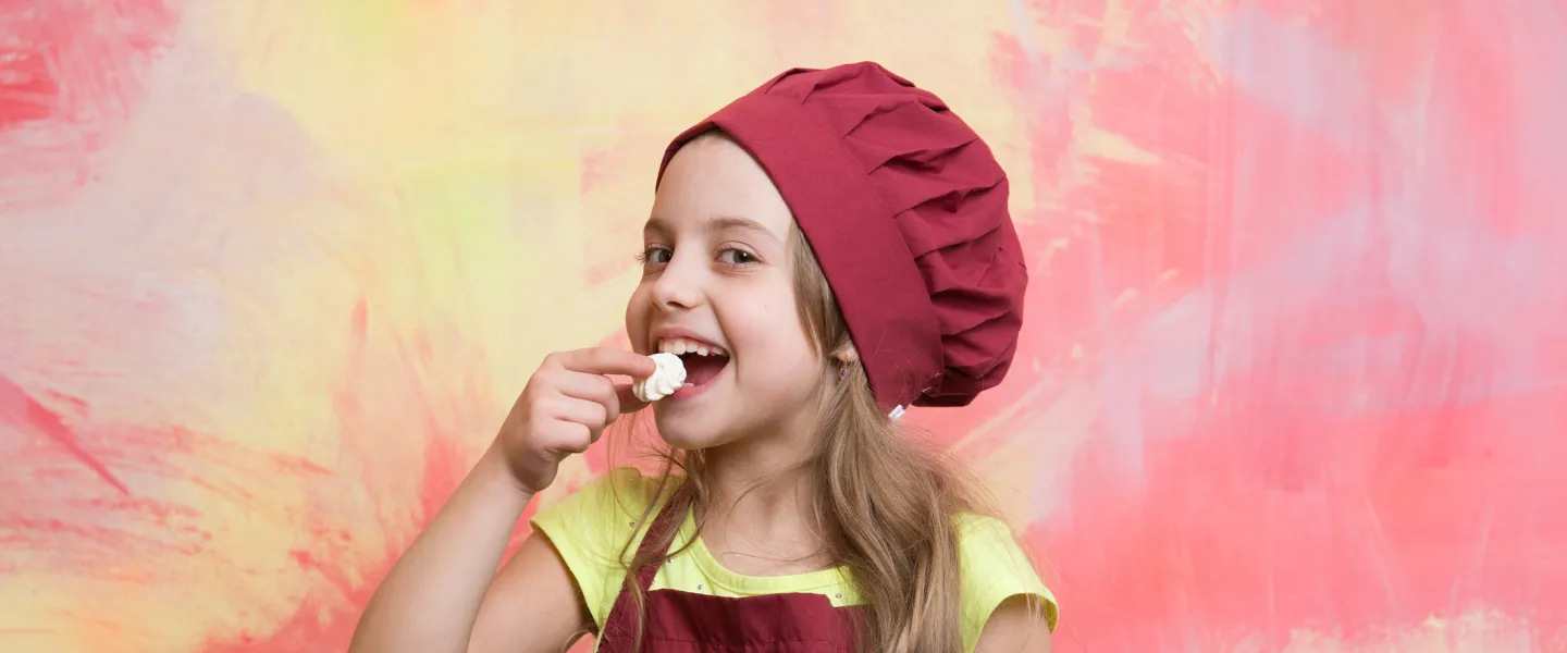 kid holding bowl of cookies