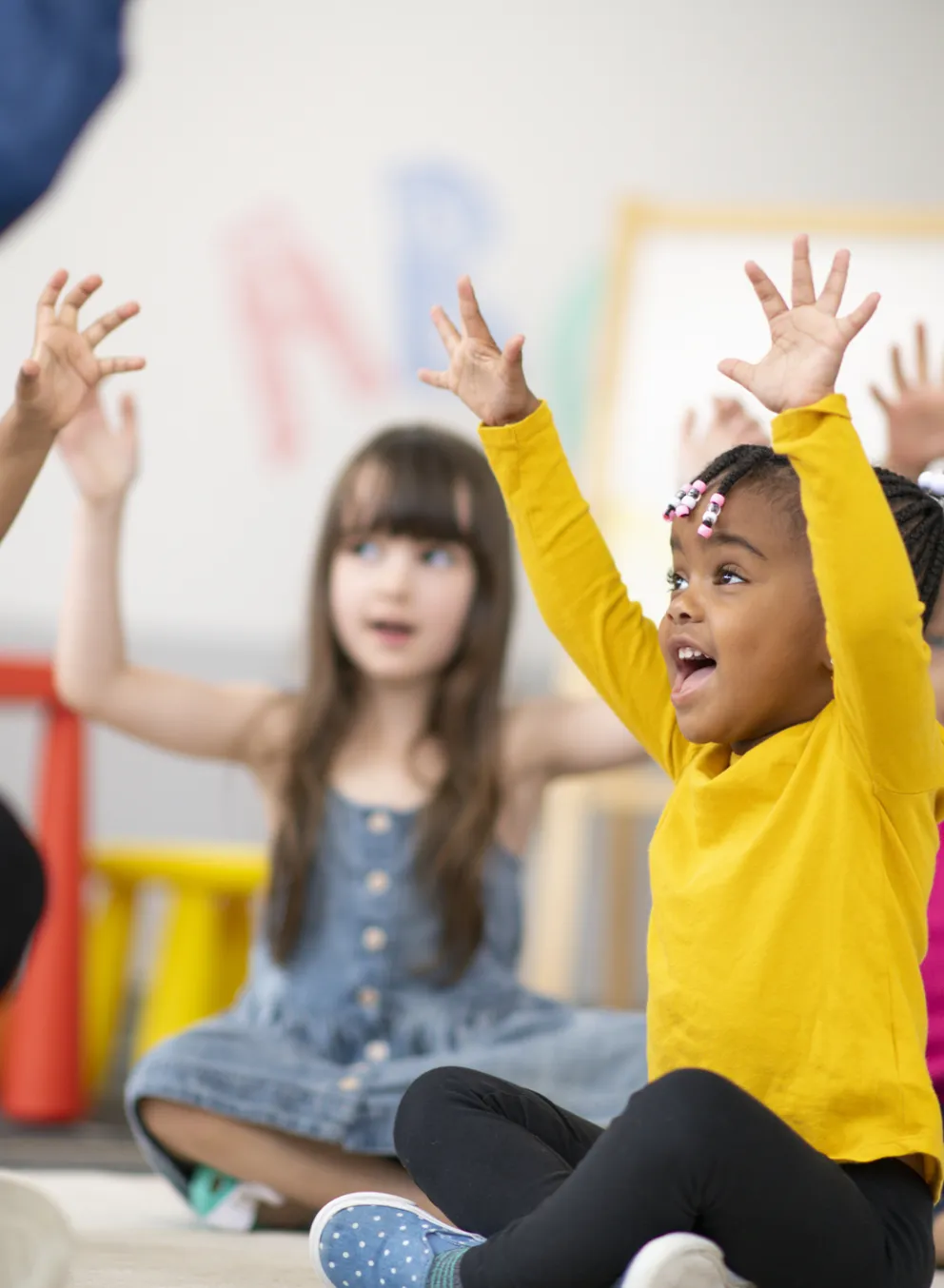 child care children with hands up
