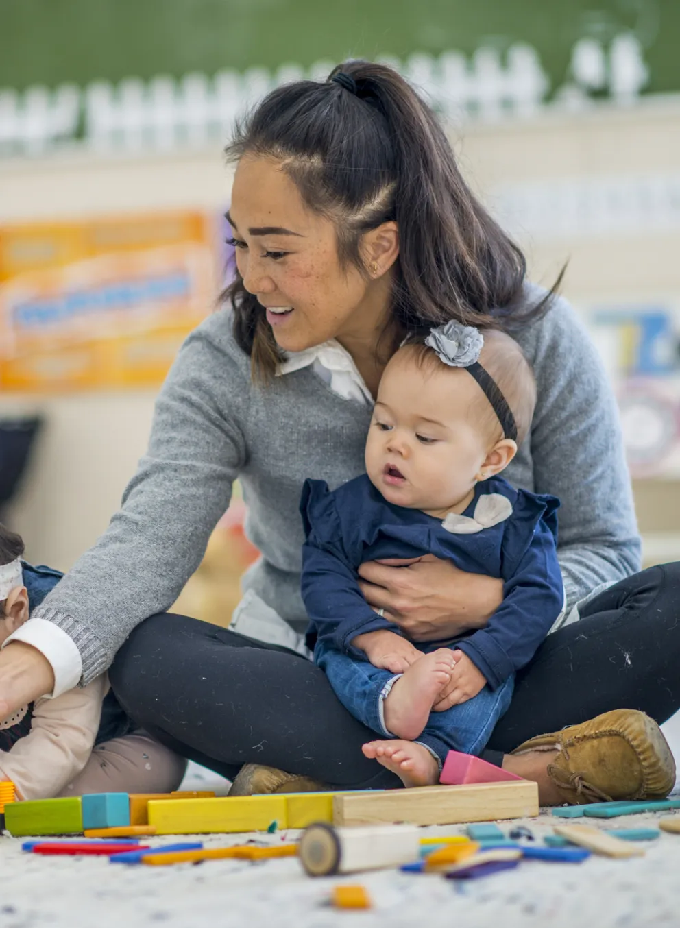 toddlers in classroom with teacher