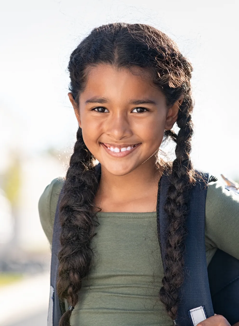 school age girl with backpack