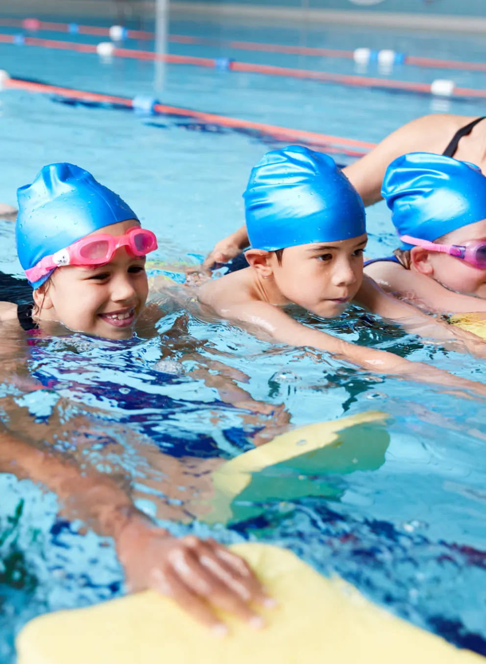 swim instructor with students in water