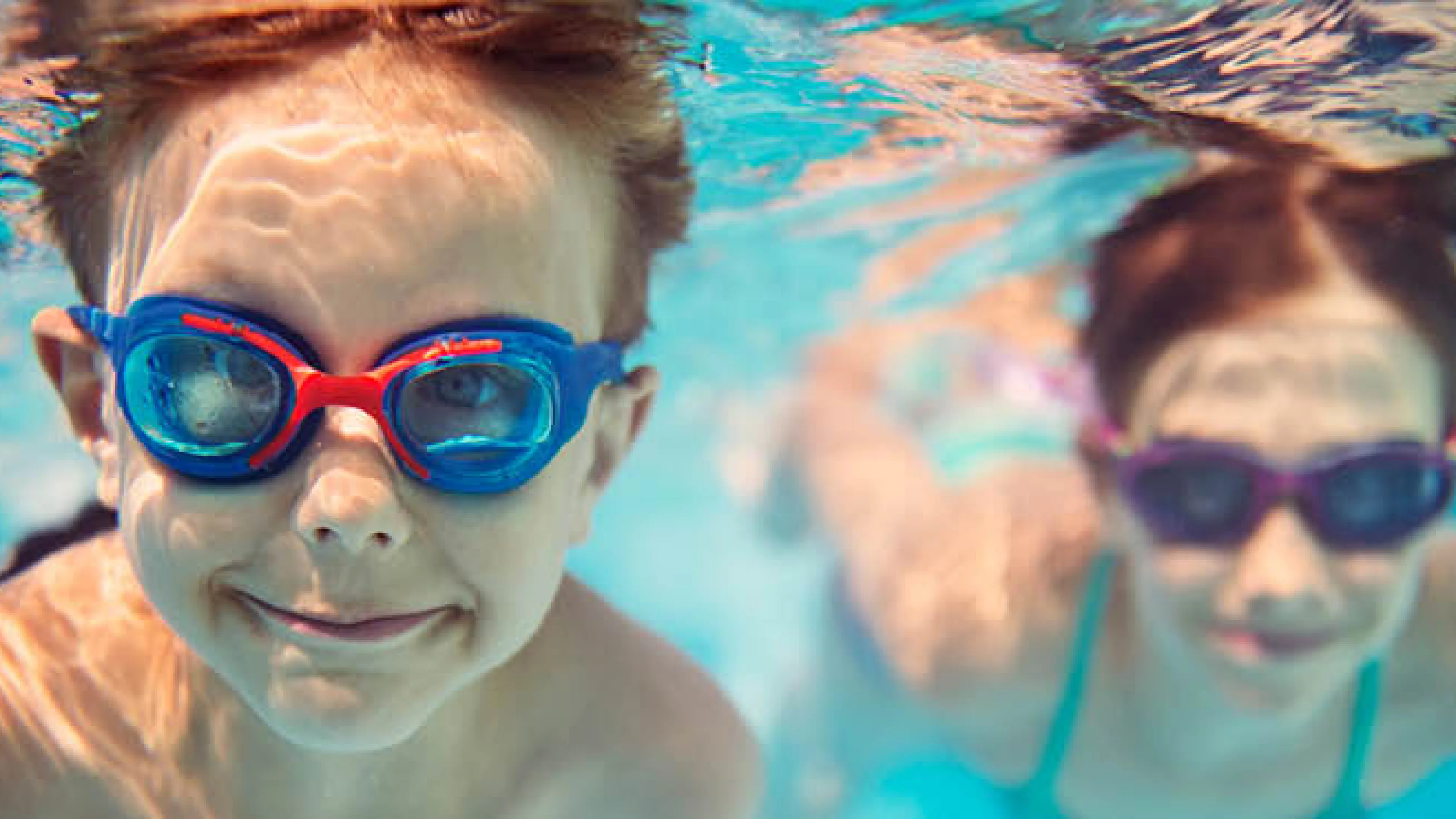 boys swimming underwater