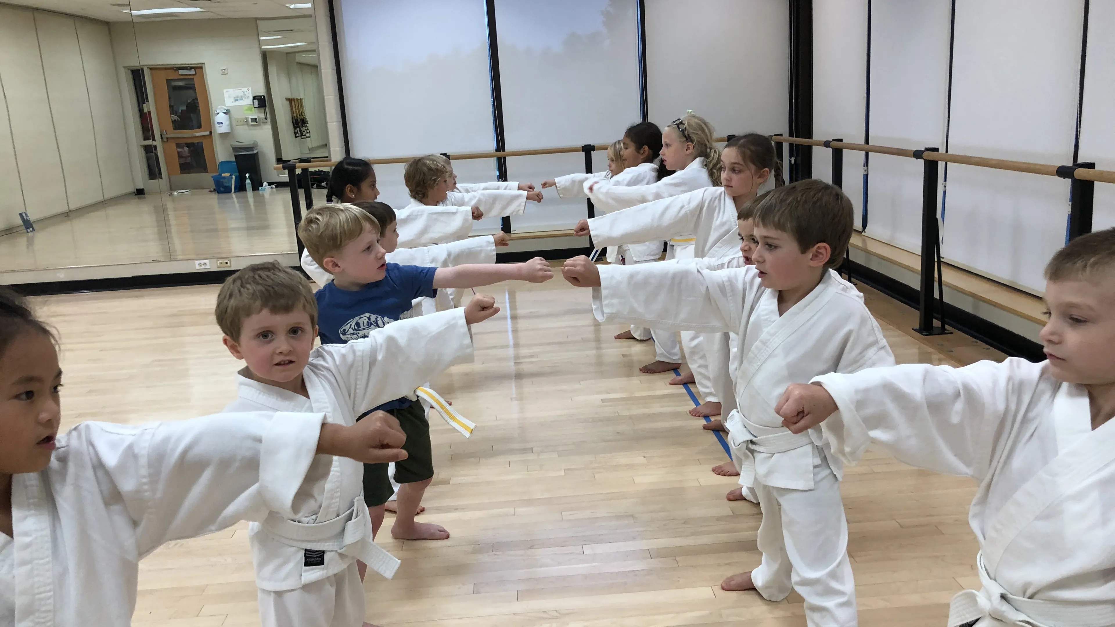 young children learning karate