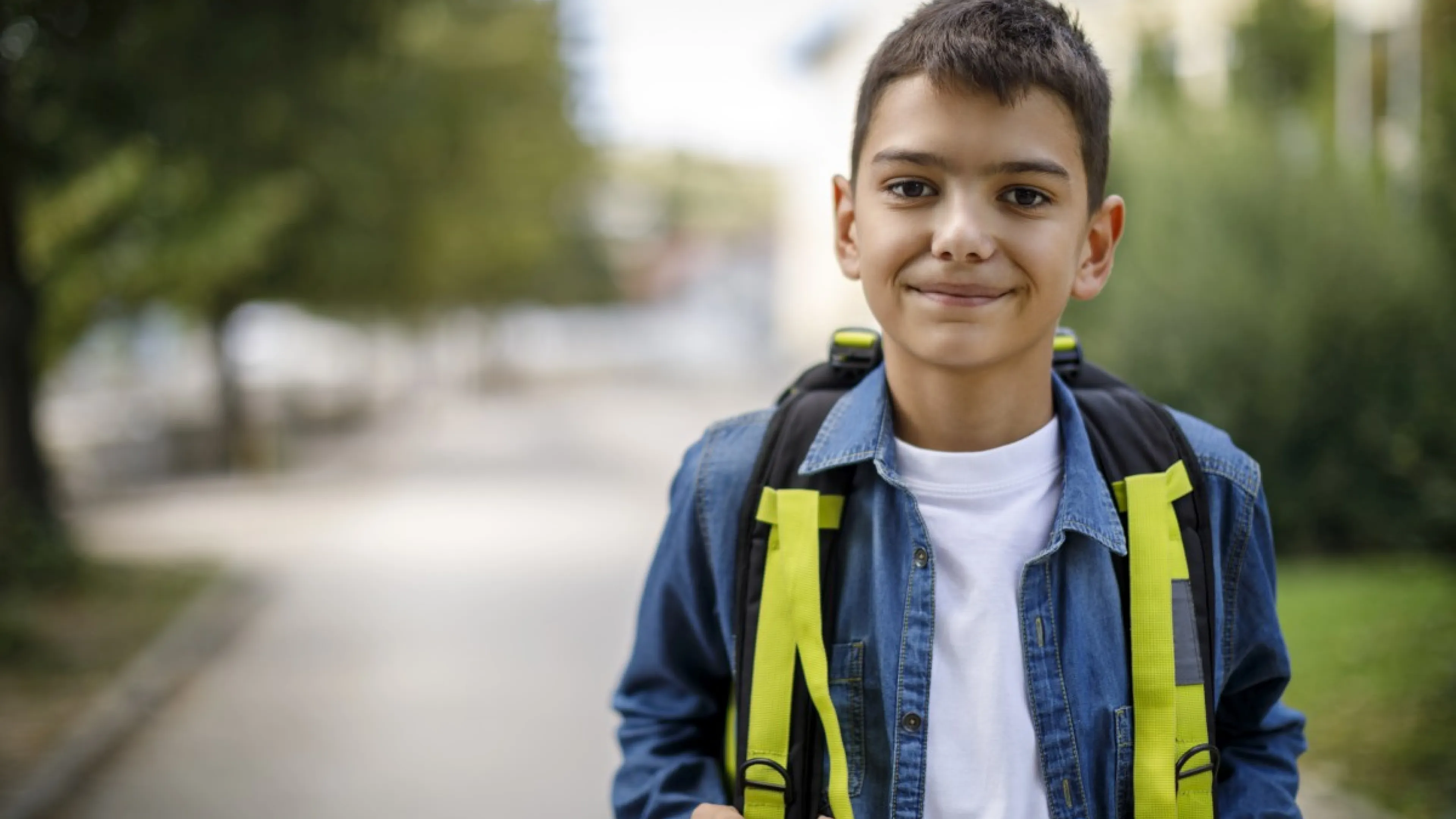 school age boy with backpack