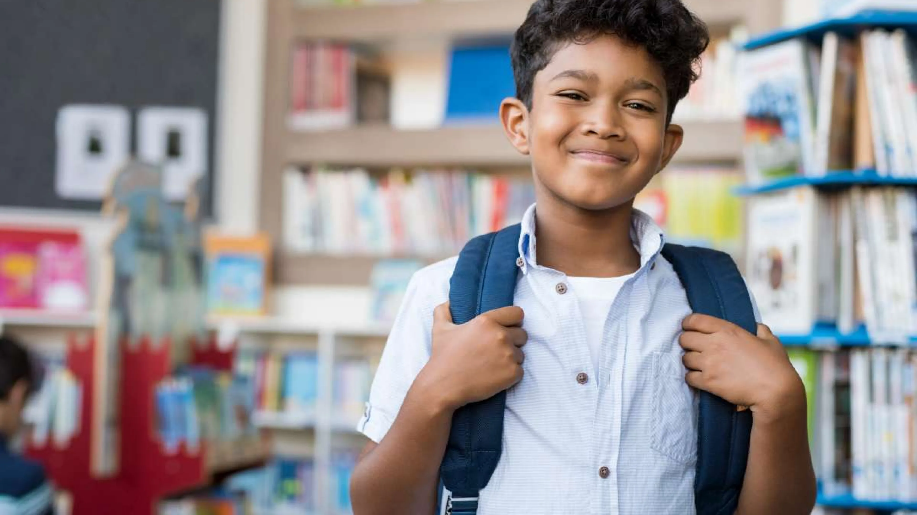 school age boy with backpack