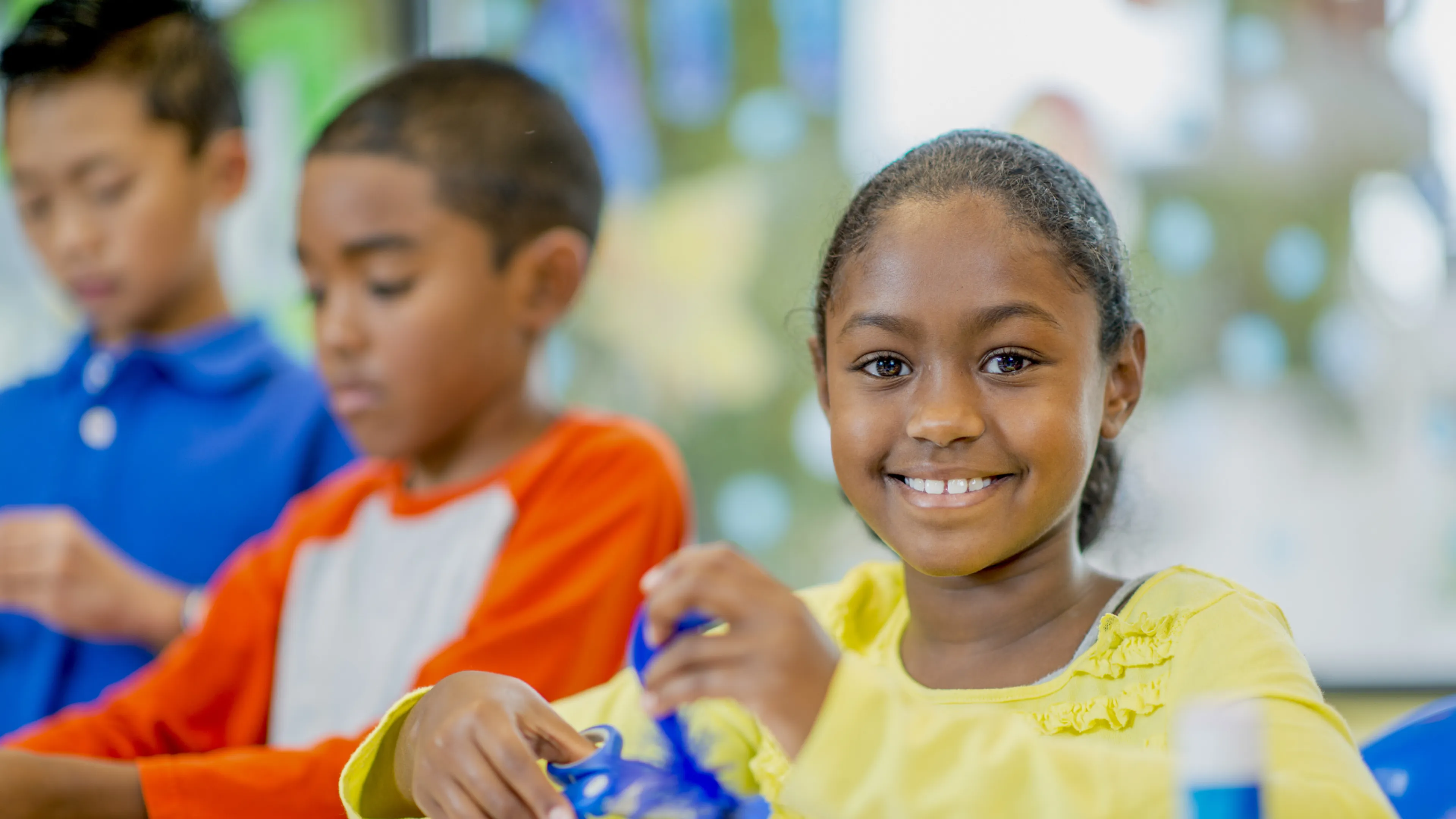 kids doing crafts at a table