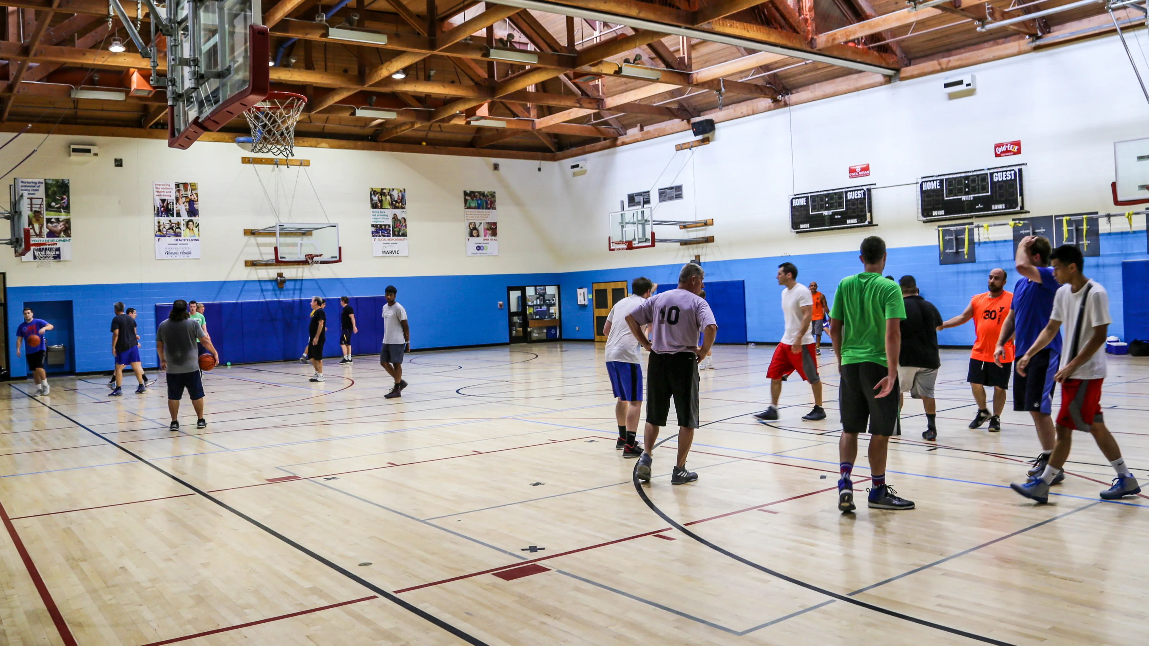 men playing basketball in gym