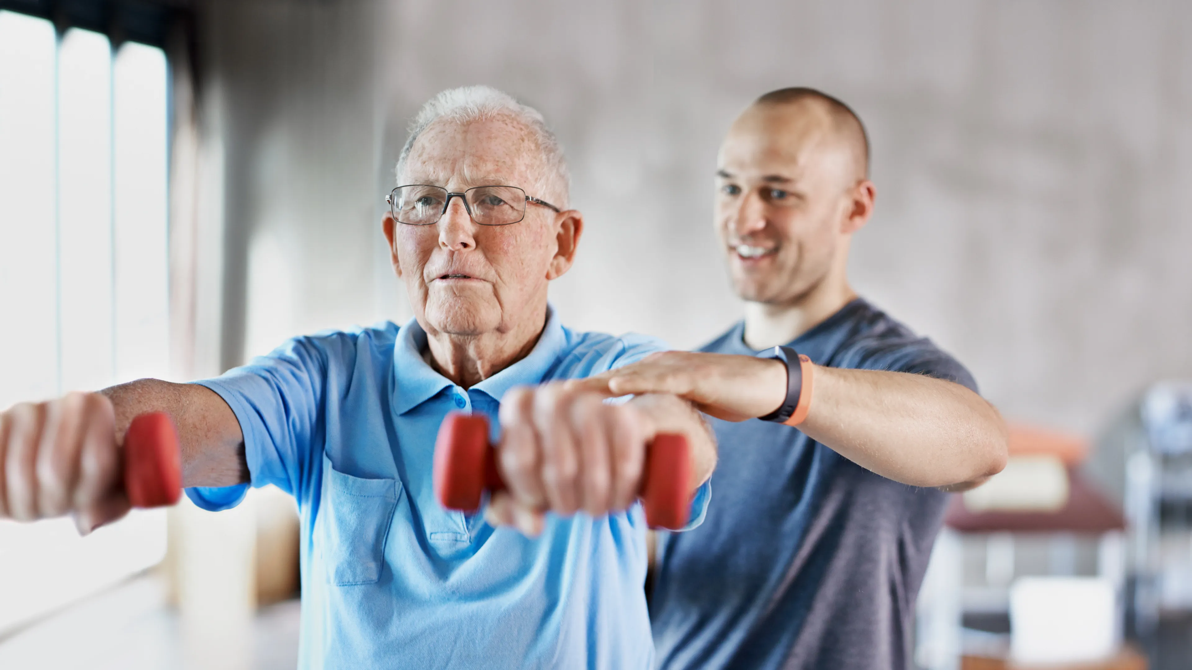 personal trainer with senior client