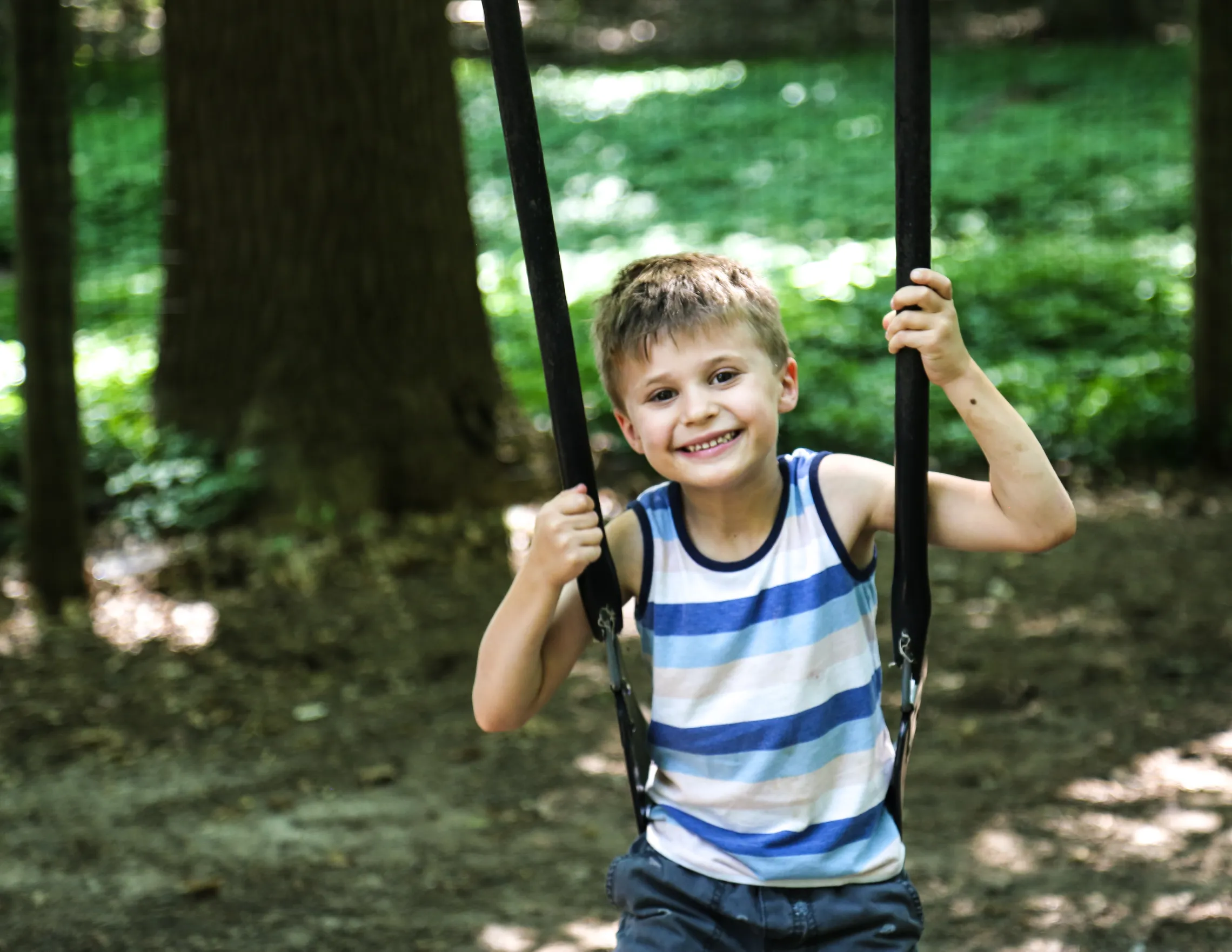 boy on outdoor swing