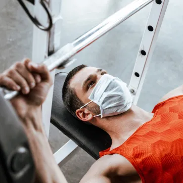 man working out with mask