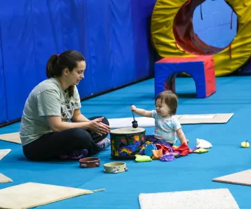 parent with child in music class