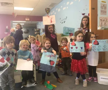 kids holding valentines