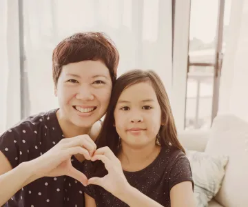 mom daughter heart hands