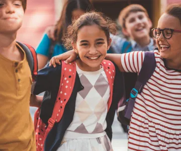 school kids wearing backpacks
