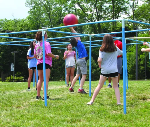 teens playing four square
