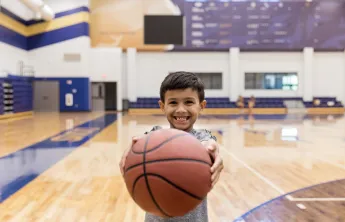 boy holding basketball