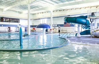 pool with water slide and play elements
