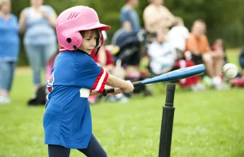girl playing tball
