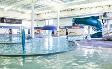 pool with water slide and play elements