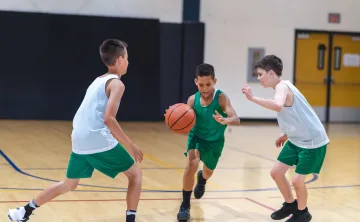 teens playing basketball 