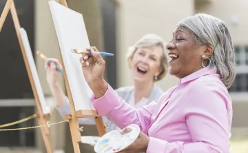 women painting on canvas