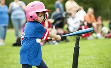girl playing tball